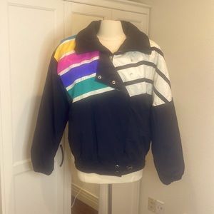 TYROLIA VINTAGE BLACK RAINBOW SKI PARKA.
